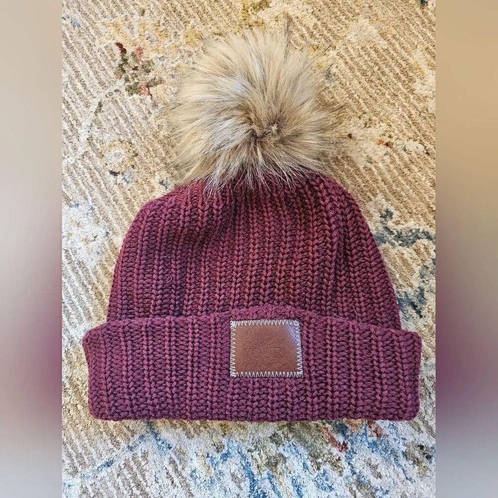 Love your melon maroon beanie with brown leather patch and removable brown fur